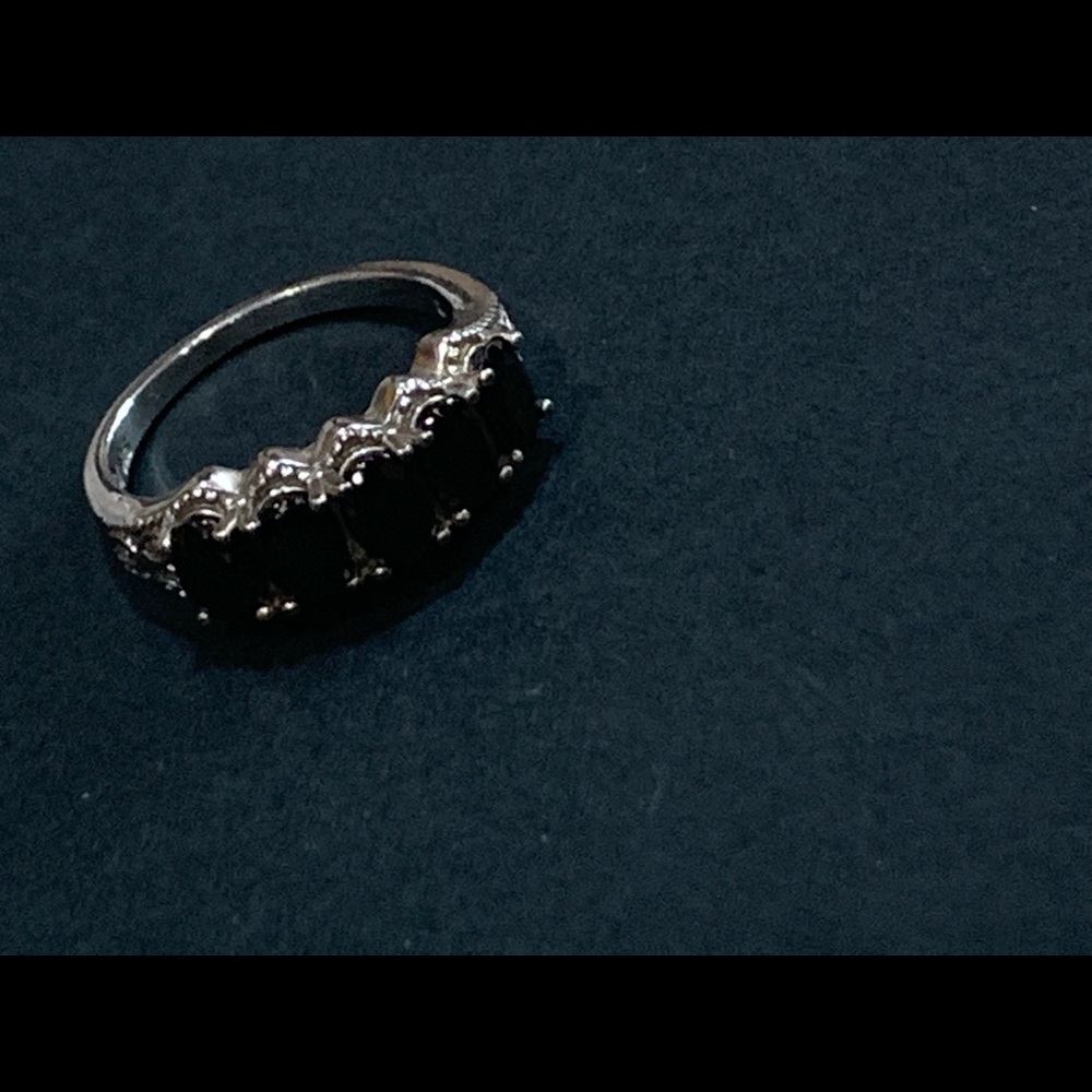 Silver ring with black stones